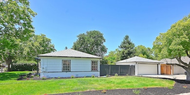 Corner side lot with house and detached 2 car garage
