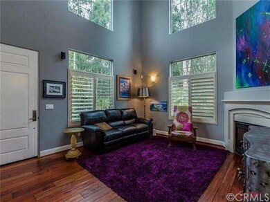 Rich mahogany floors, high ceilings, and open floo