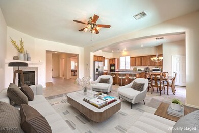 Living area with arched walkways, a tile fireplace