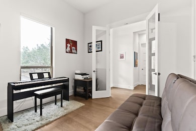 Private study with glass French doors at entry.