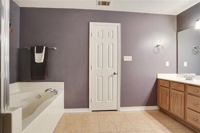 Master bath with 2 sinks, walk-in shower, soaking