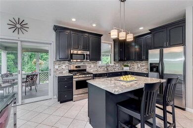 Newly painted custom cabinetry, ceramic tile floor