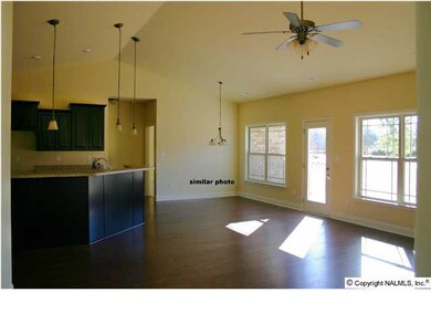 Kitchen and Breakfast Area. Ceramic Tile is Standard and Laminate Countertops. Similar Photo