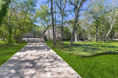 Electric gate to huge driveway with plenty of parking ~ Full RV hookup behind the fencing ~