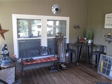 Covered porch accessed from kitchen/breakfast area