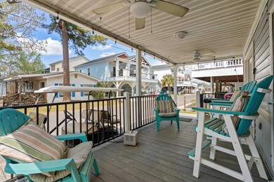 Deck featuring a ceiling fan and a residential vie