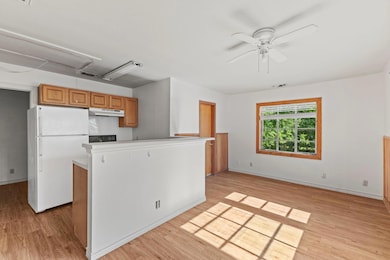 Kitchen featuring visible vents, freestanding ref