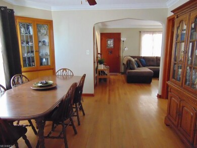 Spacious dining room with hardwood flooring