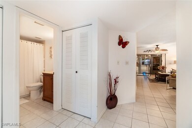 Hallway with light tile patterned flooring