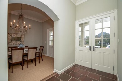 ENTRY with 12  ceiling, double French doors, 16
