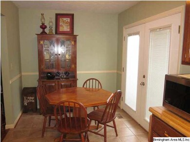 French doors lead to deck and backyard.