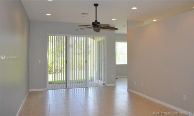 living room with sliders to the patio and backyard