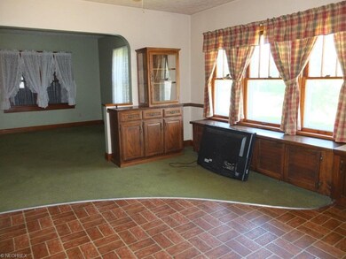 Dining room with built in storage bench open to th