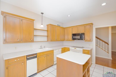 Kitchen featuring open shelves, white appliances, light tile patterned floors, light countertops, and recessed lighting