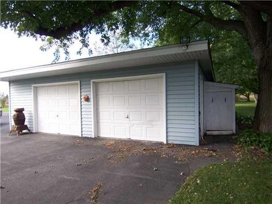 Exterior Front. Two and a half car garage has a le