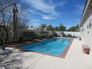 Property Photo. In-ground swimming pool with auto-