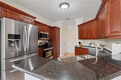 Kitchen with dark stone countertops, kitchen penin