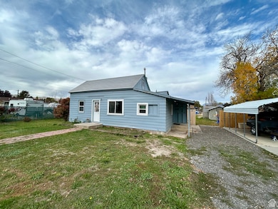 View of front of property with a carport