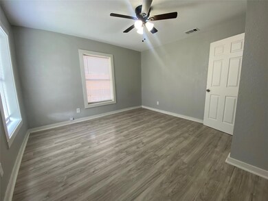 Unfurnished room featuring hardwood / wood-style floors and ceiling fan
