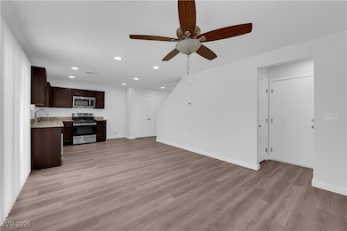 Unfurnished living room featuring recessed lightin