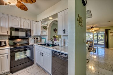 Kitchen featuring a sink, light tile patterned flo