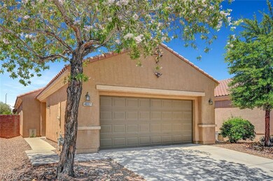 View of front of property with a garage, driveway,