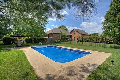 Pool is gated and separate from the fenced back yard.