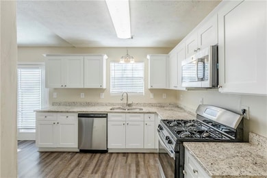 Kitchen with appliances with stainless steel finis