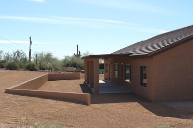 COVERED REAR PATIO AND BACK YARD