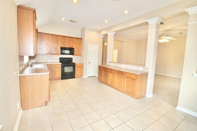 Spacious kitchen opens up to a breakfast area.