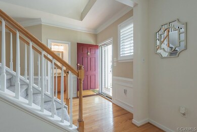 Wonderful Foyer with heavy Trim and Powder Room