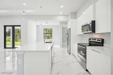 Kitchen featuring stainless steel appliances, marb