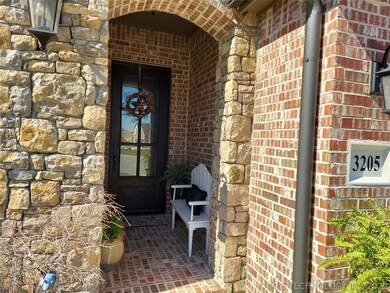 Stack stone porch entrance with black premium fron