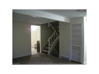 Built in bookcase helps define the living room.