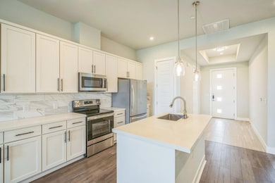 Kitchen featuring stainless steel appliances, a s