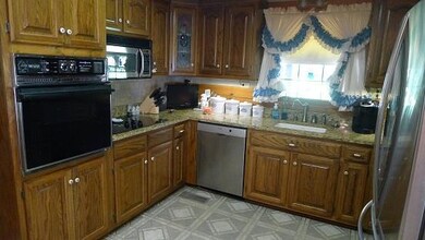 Remodeled Kitchen With Granite and Deluxe Stainless Appliances