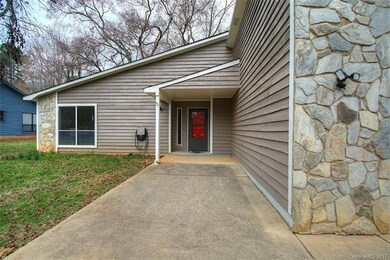 Covered front porch with flat entryway and large d