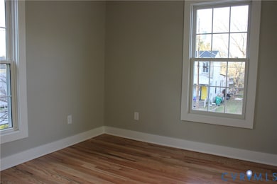 Unfurnished room with wood finished floors