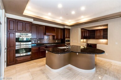 KITCHEN WITH GRANITE COUNTER TOPS AND STAINLESS STEEL APPLIANCES