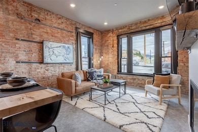 Sitting room with brick wall