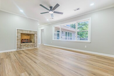 Family room with ceiling fan, ornamental molding, 