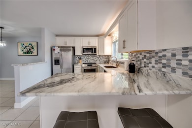 Kitchen with stainless steel appliances, light til