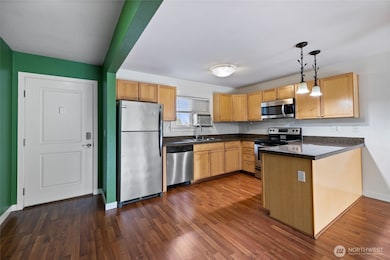 Bright kitchen with stainless appliances and plenty of counter space.