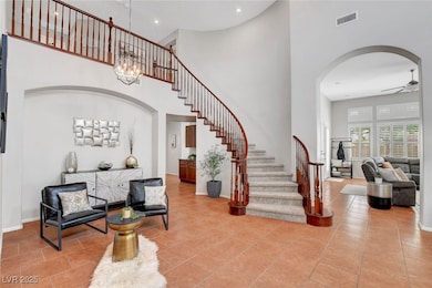 Foyer entrance with visible vents, arched walkways