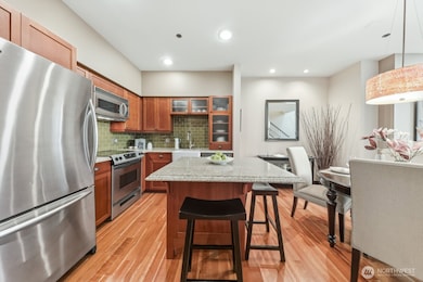 Warm and inviting kitchen flows seamlessly into the dining space.
