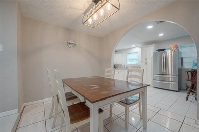 Connected to the kitchen is the dining area creating a seamless flow for entertaining guests or enjoying meals.