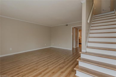 Entryway allows you to go upstairs to the bedrooms or on to the main floor.