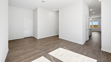 Spare room with dark wood-style flooring, ceiling fan, and recessed lighting