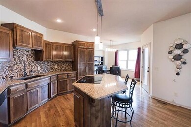 Kitchen with island, granite counter tops, mosaic 