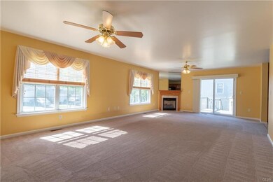 Great room with gas fireplace and sliding door to 
